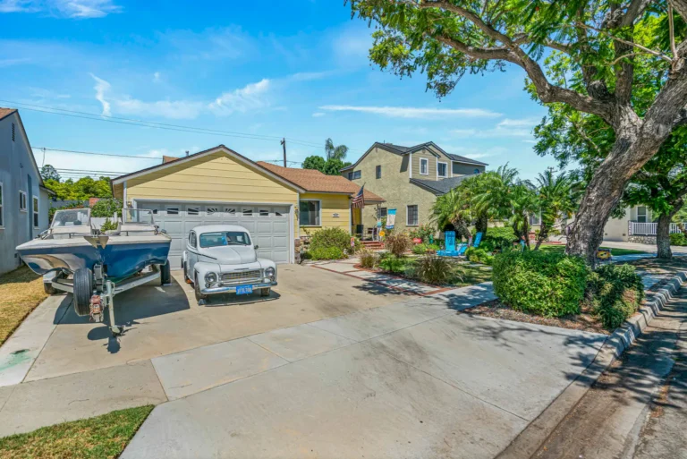 Single-story duplex with a shared driveway and detached garage